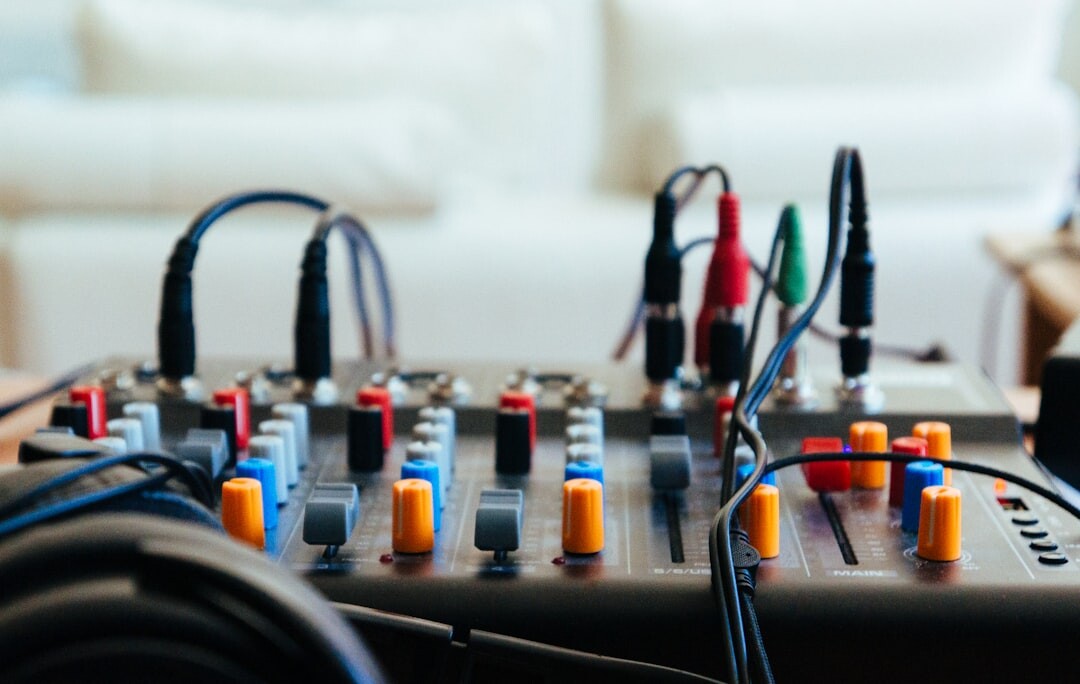 Behind the scenes of a podcast recording studio with microphones and mixing equipment