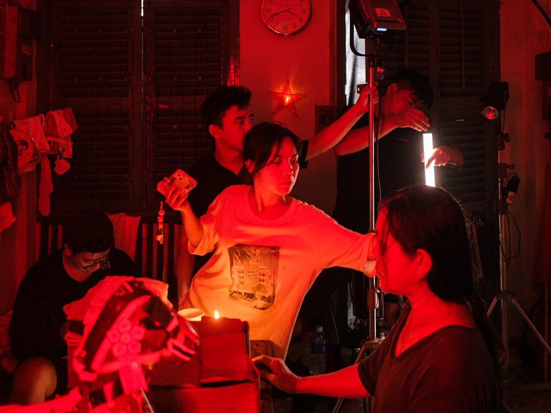 Small group practicing an on-camera interview exercise with studio lighting