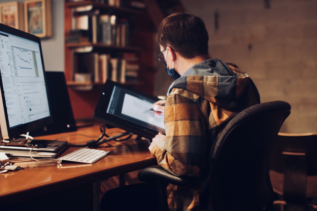 man studying media at desk